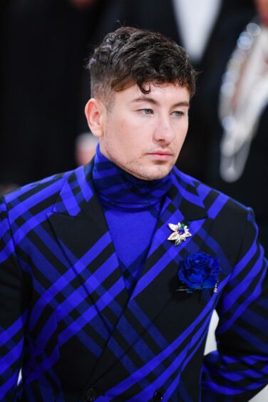 Barry Keoghan wearing a blue and black suit at the Met Gala. 