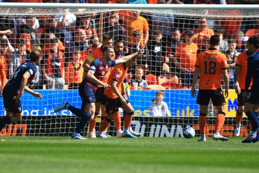 Jordan White celebrates after making it 1-0 to Ross County against Dundee United.