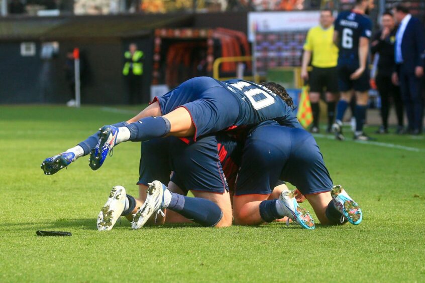 Ross County celebrate as they defeated Dundee United at Tannadice.