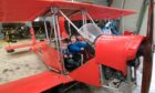 One-year-old Cairn Lynch and brother Darra, 3, in the centre's Red Baron replica. Image: Paul Reid