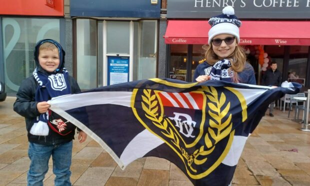 Young fans Abe Egen and Kayla Disbury-Low with a Dundee flag