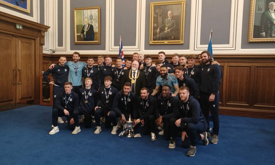 The Dundee team with the trophy and Lord Provost Bill Campbell in Dundee City Chambers