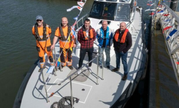 Pilot crew Jim Kidd, Richard Talbert, Darren Murray, Jim McDonough and Bryan Robbie at Montrose Port. Image: Paul Reid