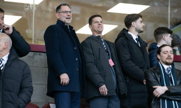 Dundee owner Tim Keyes (centre) and managing director John Nelms (left) watch on as Dundee beat Queen's Park on Friday. Image: SNS.