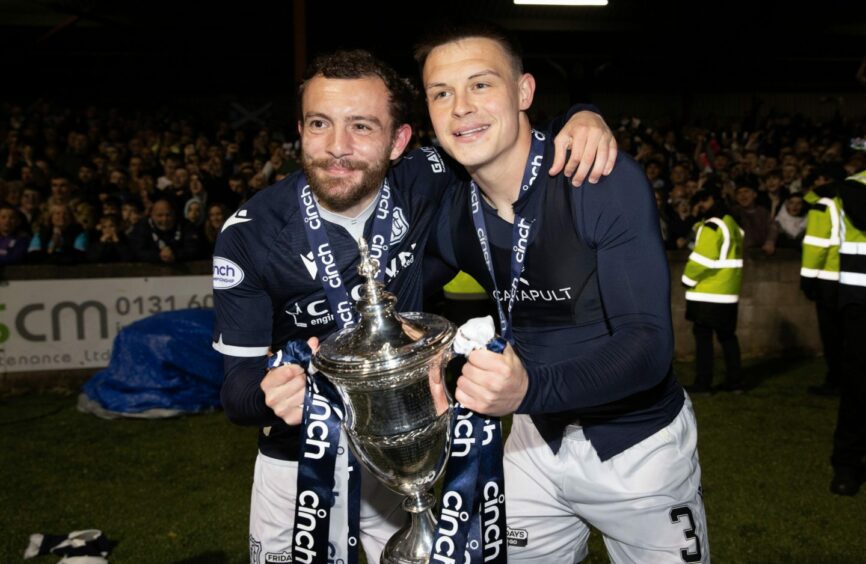 Paul McMullan and Jordan Marshall celebrate with the Championship trophy - both though have left Dundee