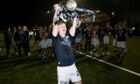 Lyall Cameron with the Championship trophy. Image: SNS.