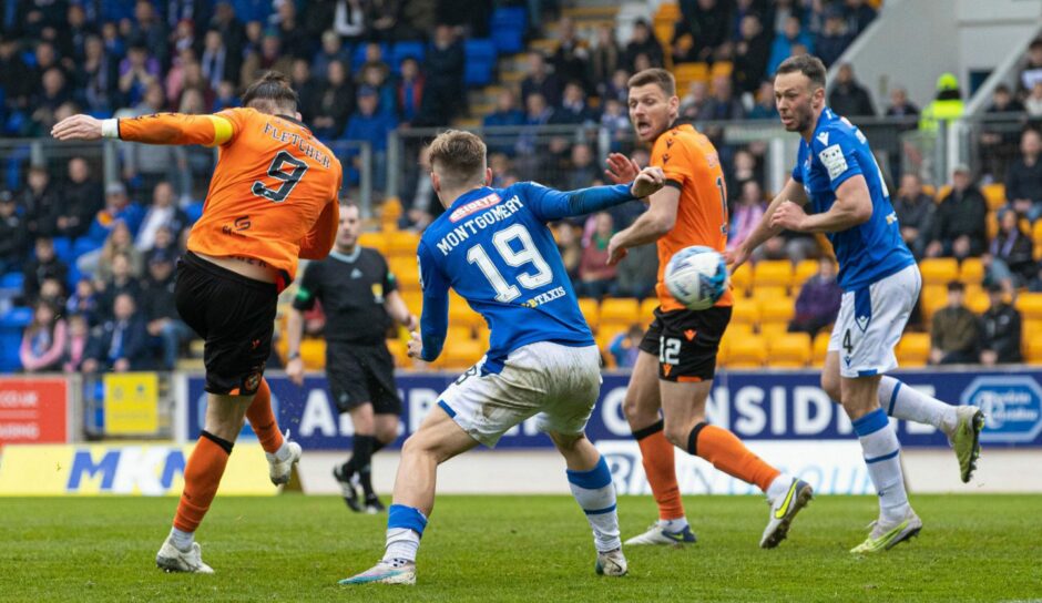 Steven Fletcher of Dundee United hits a volley against St Johnstone