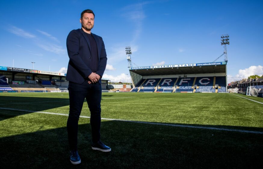 Andy Barrowman stands beside the pitch at Raith Rovers' Stark's Park.