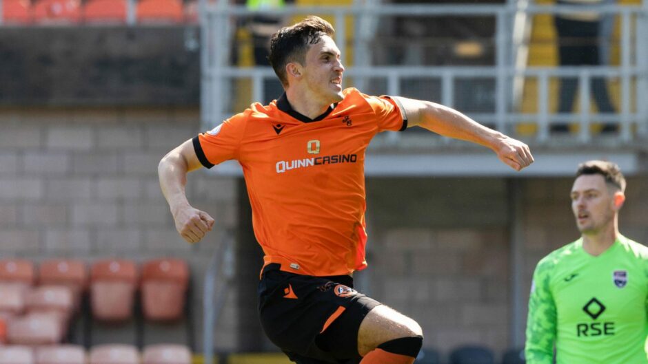 Jamie McGrath celebrates a converted penalty for Dundee United