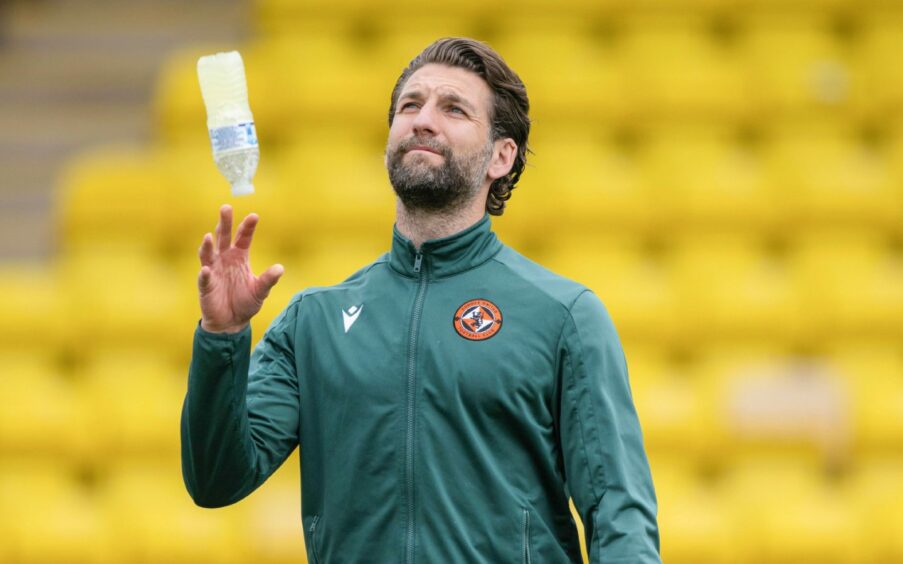 Charlie Mulgrew throws a water bottle while on Dundee United duty at Livingston