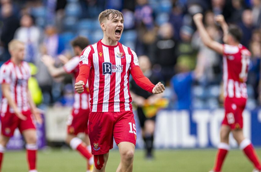 Adam Montgomery celebrates at Kilmarnock as Saints get the win they needed to stay up.