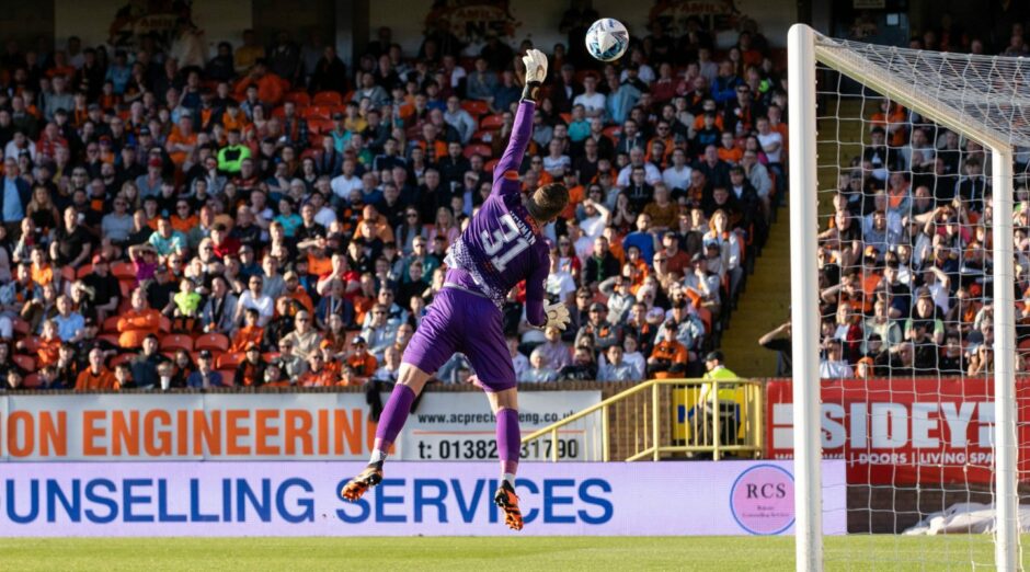 Dundee United's Jack Newman makes a diving save against Kilmarnock. Image: SNS.
