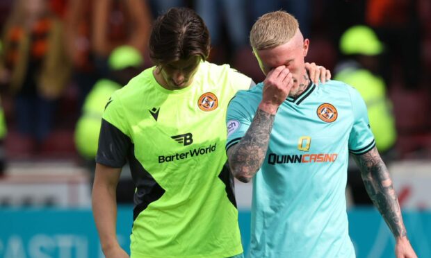 Ian Harkes and Craig Sibbald are dejected after United's relegation is confirmed. I
