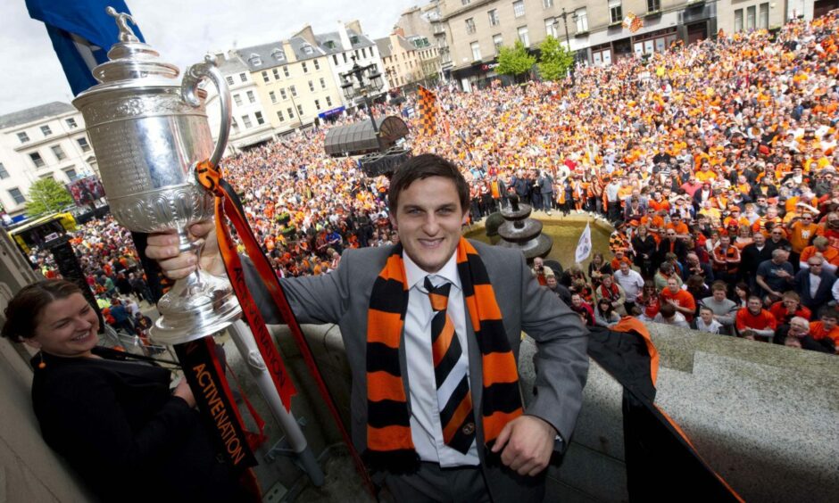 Craig Conway parades the Scottish Cup in front of adoring Arabs