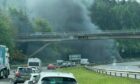Cars on M90 north of Glenfarg due to vehicle fire.