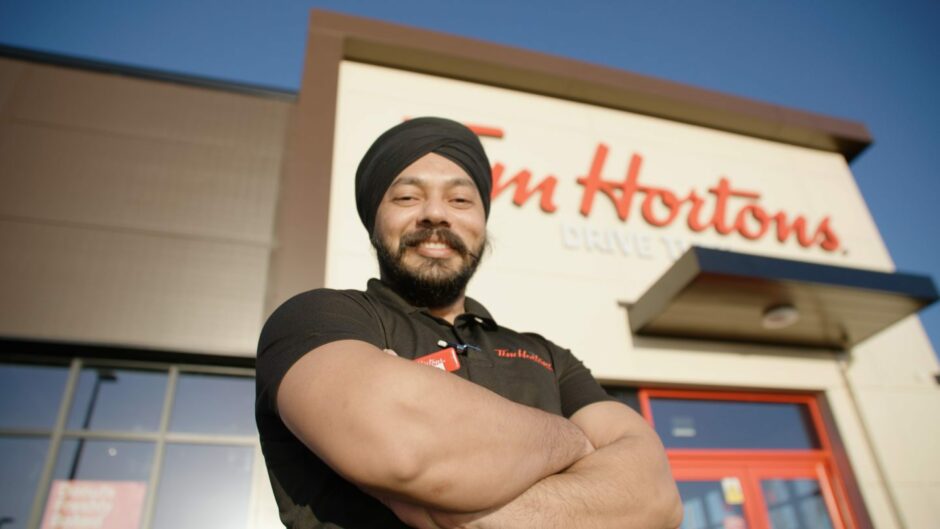 Regional manager Harpreet Singh standing outside the Dundee Tim Hortons store. Image: Maximus.
