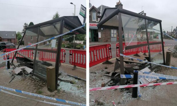 A bus shelter in Meigle leaning to one side and covered in police tape after a car crashed into it