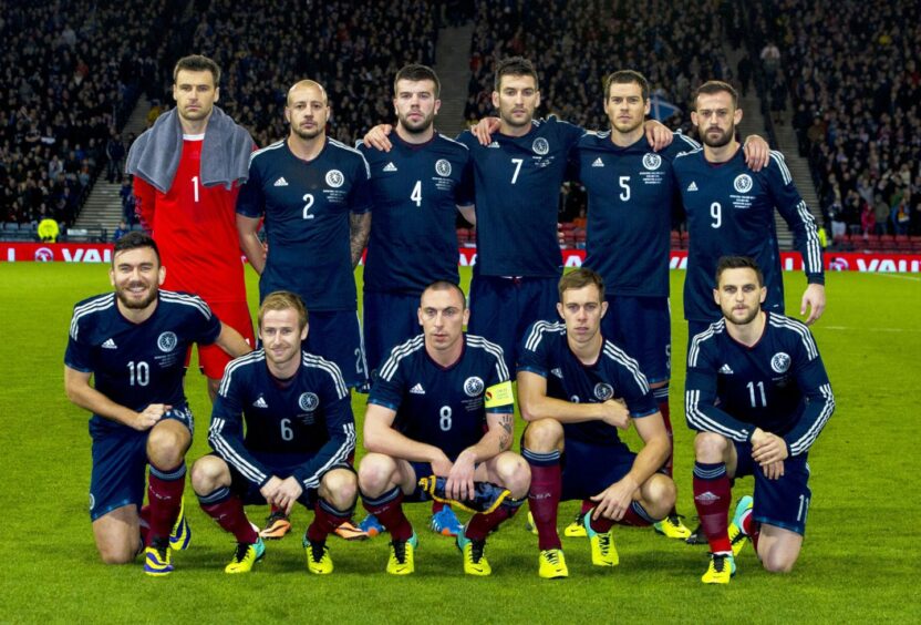 Conway, 11, lines up with current United stars Mulgrew, 7, and Fletcher, 9, for Scotland against the USA. Image: SNS.