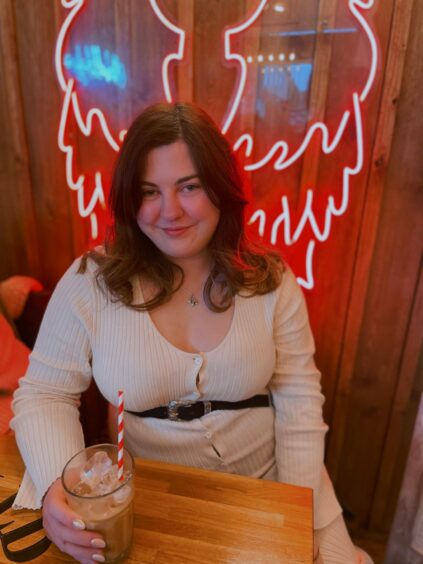 A photo of Hannah Ballantyne at a local Perth cafe.