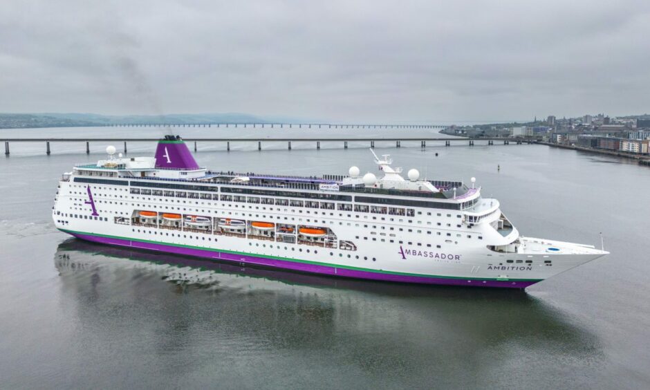 Aerial photo of the Ambassador Ambition cruise liner in the River Tay at Dundee, with the Tay bridges in the background.