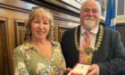 Jackie Campbell receiving her BEM from Dundee Lord Provost Bill Campbell. Image: Jackie Campbell.