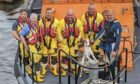 The lifeboat crew with Arlow the dog who was rescued from a broken down speedboat. Image: Broughty Ferry Lifeboat/Facebook
