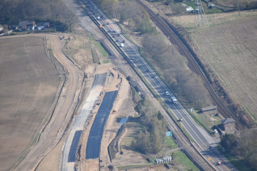 Cross Tay Link Road update, aerial view above the road. The A9 northern tie-in looking south (to Perth). 