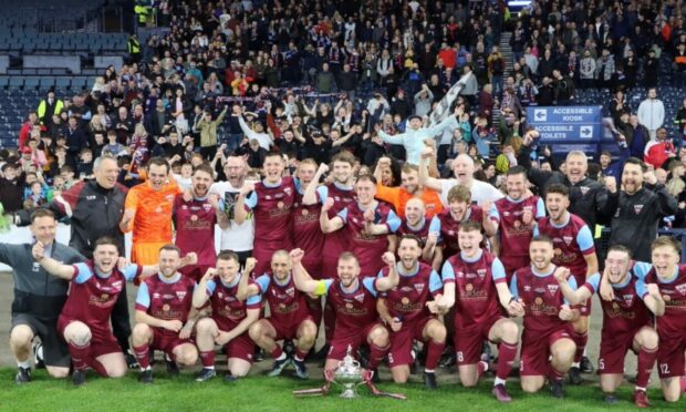 Cupar Hearts celebrate their triumph.