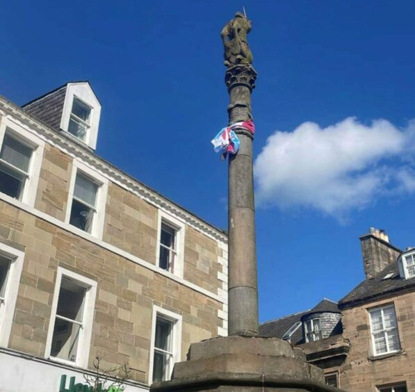 A Cupar Hearts scarf was wrapped around a monument by jubilant fans