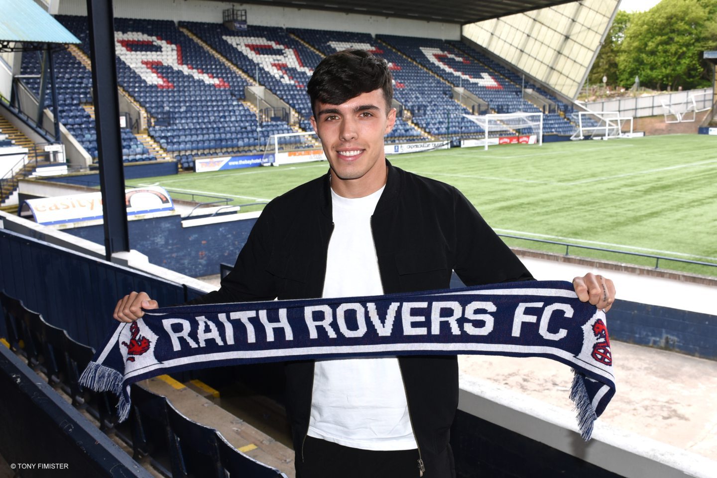 Dylan Corr holds up Raith Rovers scarf at Stark's Park.