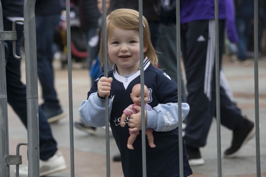 young girl, aged about three, in a Dundee FC top.