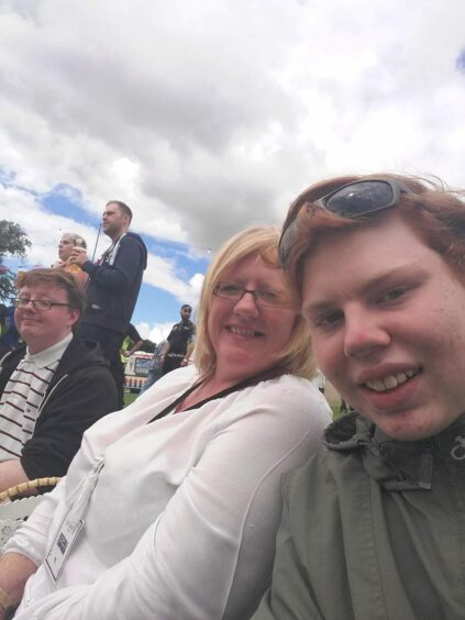Andrew Batchelor with his mother and brother in the crowd at the Carnival 56 festival in Dundee.
