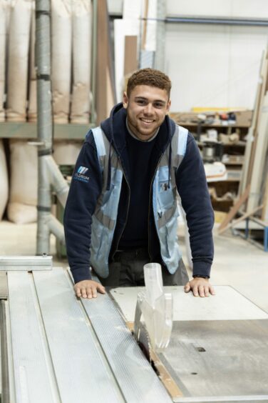 Tai McCluskey, pictured beside a workbench, is the first recipient of the new heritage trades apprenticeships fund in Perth. Image: Perth Guildry.