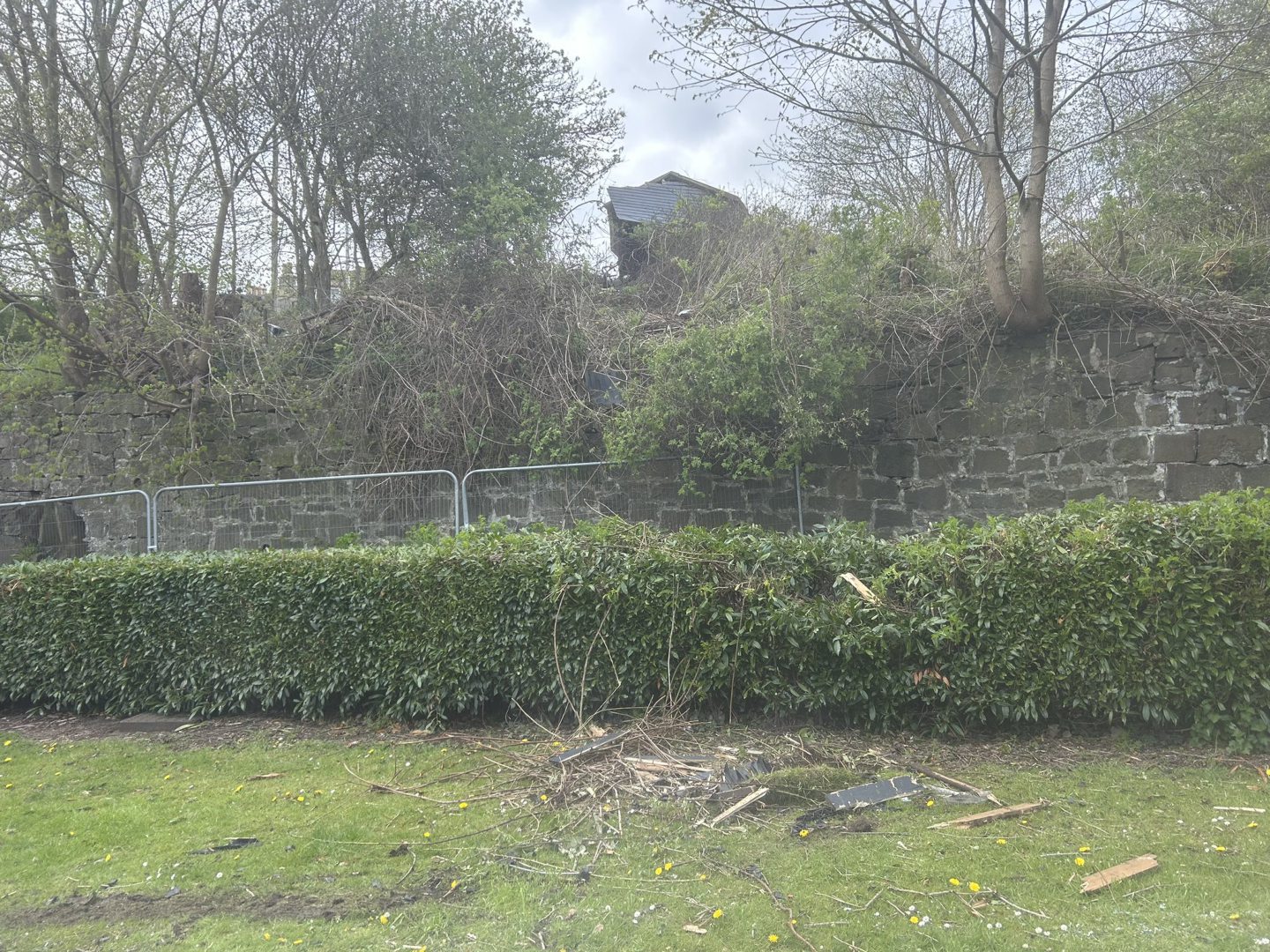 Car hits garage and crashes down 40ft bank in Inverkeithing