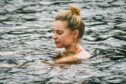 Cold water swimming in the River Tay helps to alleviate some of Hannah's chronic fatigue syndrome symptoms. Image: Supplied by Hannah Charles Picture shows; Hannah Charles in a river in Perthshire. Perthshire. Supplied by Hannah Charles