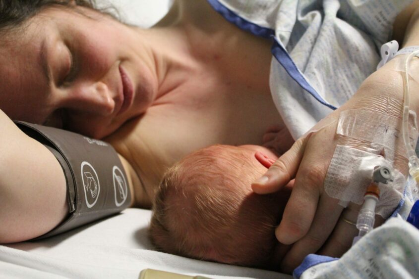 Perthshire mum Hazel Oates pictured with her son moments after he was born. Image: Hazel Oates.