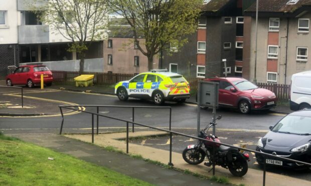 Police at Hilltown Court in Dundee. Image: James Simpson/DC Thomson