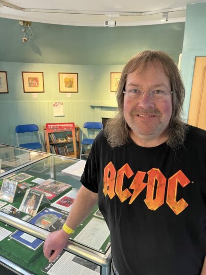 AC/DC superfan Neil McDonald from Edinburgh with a tiny part of his collection at Kirrie Gateway to the Glens museum.