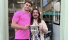 Jack Nelms, son of Dundee Football Club's managing director John, took the Scottish Championship trophy to Lovett's Barbershop in Broughty Ferry.