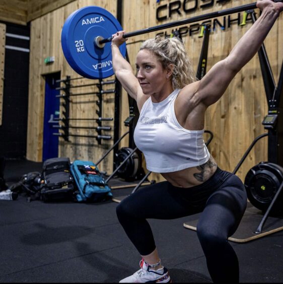 Dundee Gladiator Sheli McCoy, pictured lifting weights, is joining the new Gladiators TV show