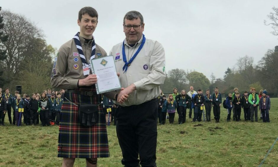 Hillside Scout Jamie Brown receives King's award.