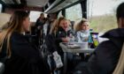 (Left to right) Dundee United Women stars Claire Delworth, Georgie Robb and Neve Guthrie on the coach journey to face Hamilton Accies. Image: Alistair Heather