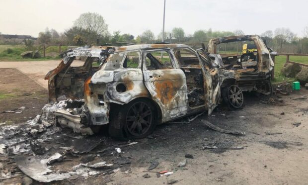 The torched vehicles on Jack Martin Way. Image: James Simpson/DC Thomson