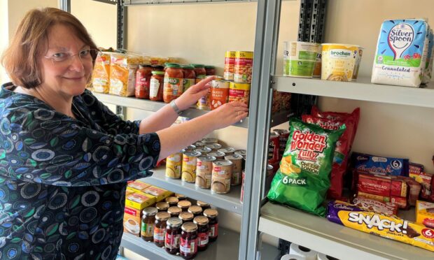 Senior lecturer Joan Cameron sorts items at the Kirkcaldy campus pantry.