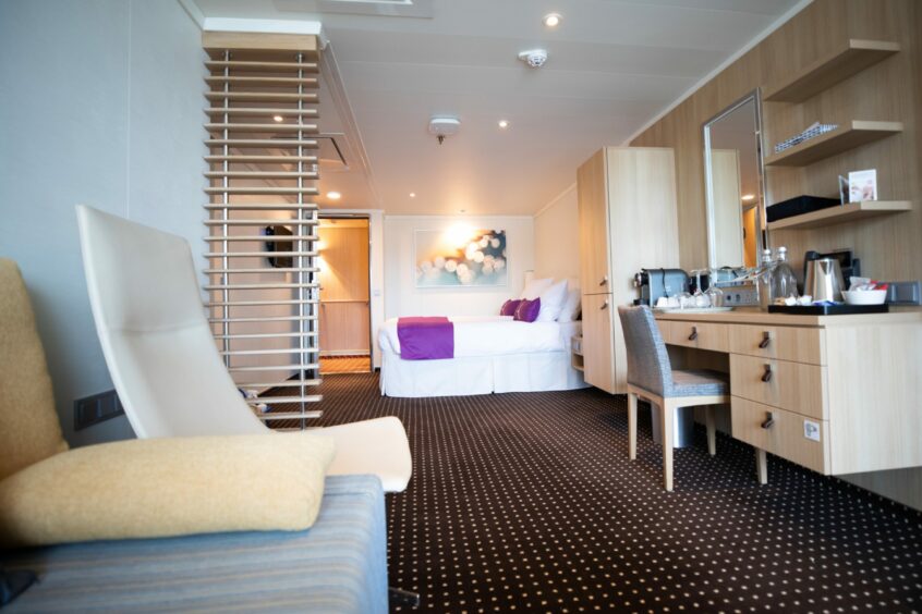 A bedroom on the Ambition cruise ship