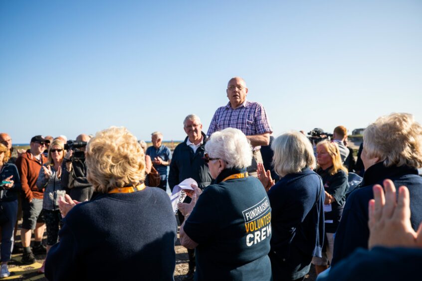 Arbroath lifeboat management chairman Ian Ballantyne addresses a protest against the RNLI decision