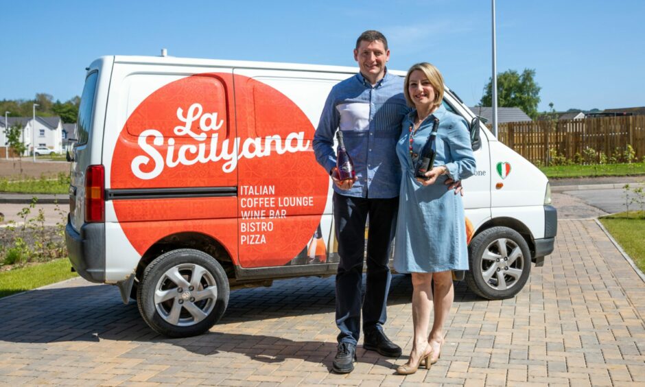Steven and Laura in front of a van with the La Sicilyana logo.