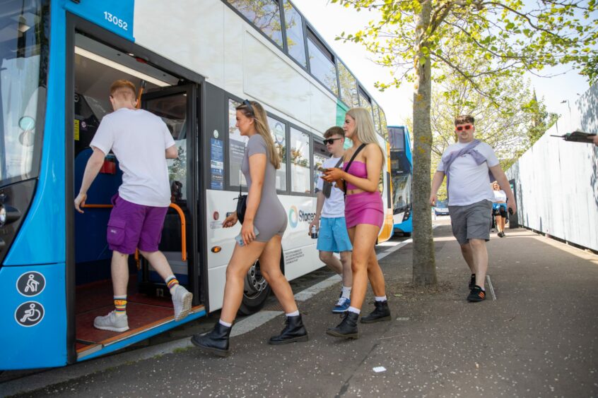 More music fans pictured boarding buses at Slessor Gardens to head to Big Weekend on Friday.