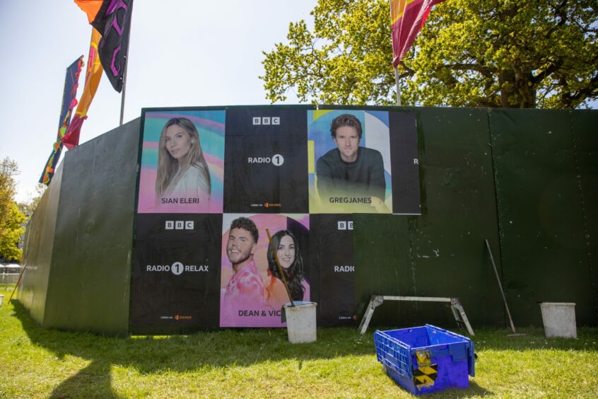 Artist posters at the Big Weekend site in Dundee.