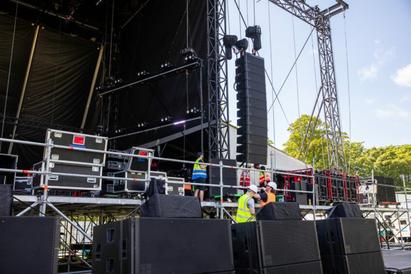 Workers setting up the Future Sounds stage for the Radio 1 festival.